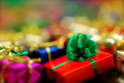 A pile of brightly-wrapped Christmas presents