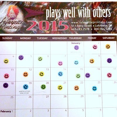 A 2015 calendar with happy-face stickers on the first 23 days of the year