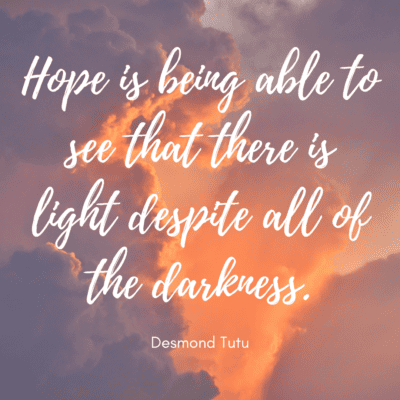 A picture of sunlit clouds with text: Hope is being able to see that there is light despite all of the darkness - Desmond Tutu